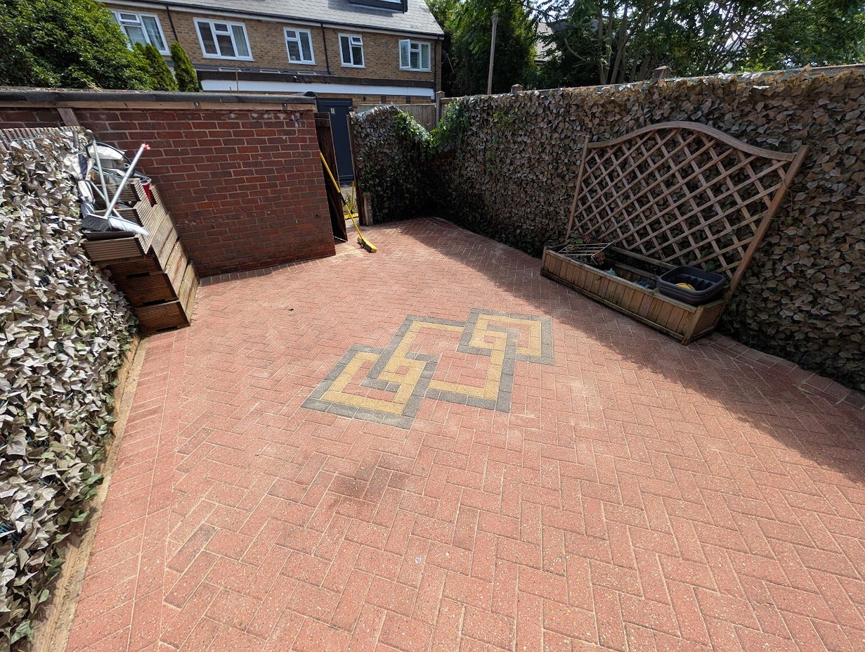 Weedy block paving cleaned after cleaning